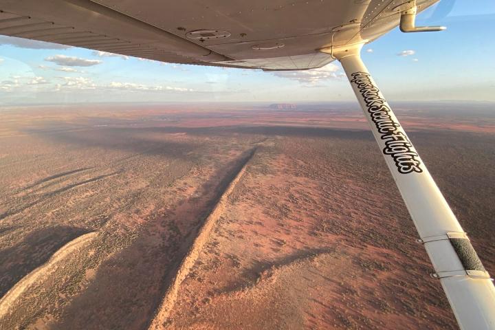 a large air plane on a dirt track