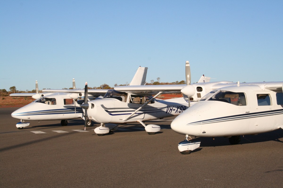 a plane sitting on top of a parking lot